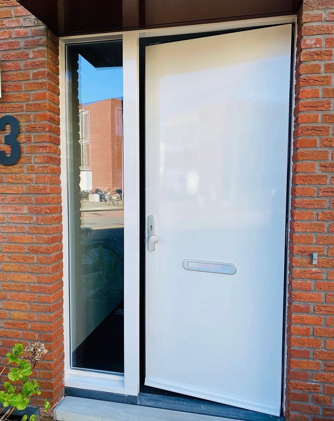Schilderwerk aan voordeur